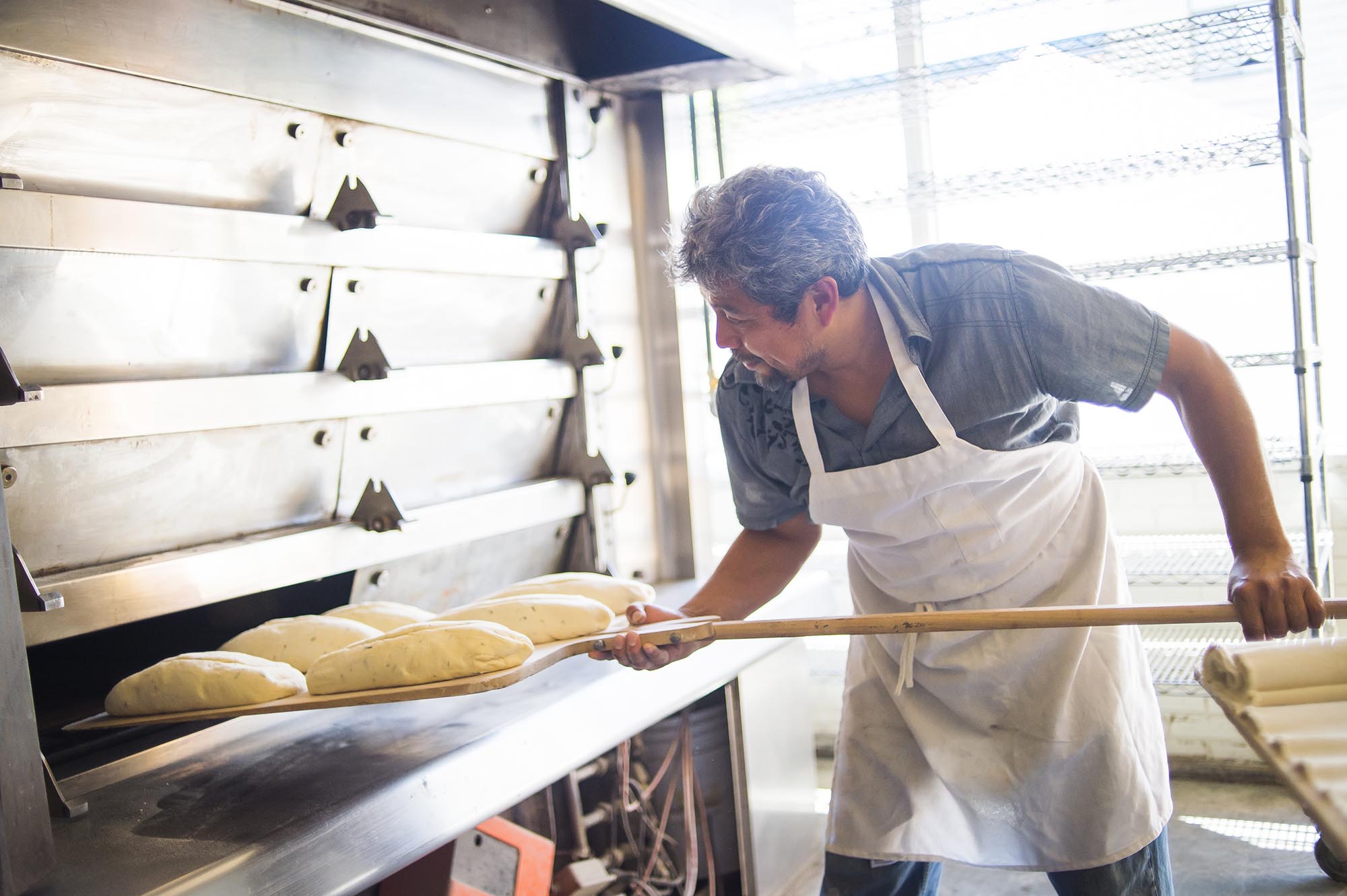 Baking bread at Wild Wheat Bakery Cafe &amp; Restaurant in Kent, Washington