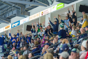 Fans cheering at a Seattle Thunderbirds game