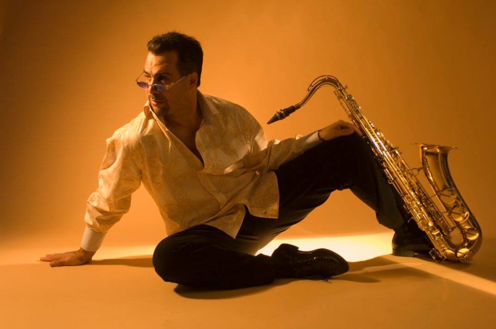 Photo of Darren Motamedy with instrument